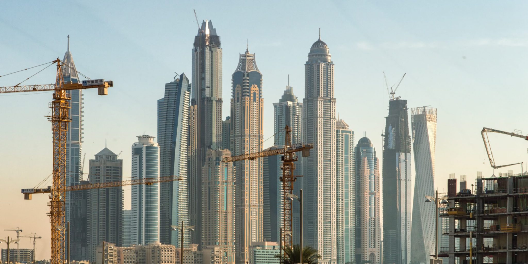 New construction work in Dubai. Marina Dubai district in the background.